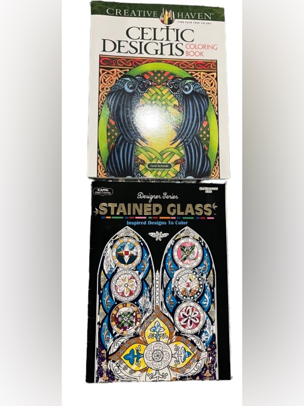 Two adult coloring books; Designer Series Stained Glass Book and Celtic Designs